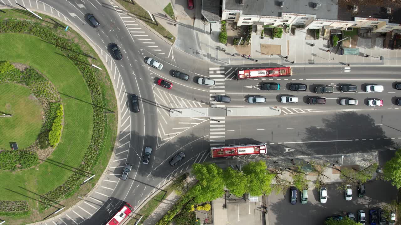 Fixed top-down drone shot of roundabout and heavy traffic in Vilnius