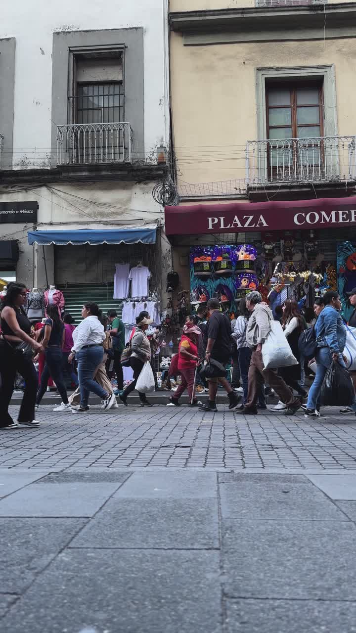 Busy afternoon on Correo Mayor Street, Mexico City