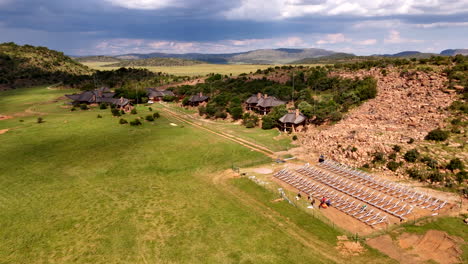 technicians install solar system at african safari lodge, sustainable energy