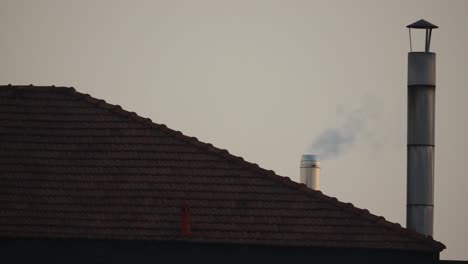 views of smoking chimneys on a house