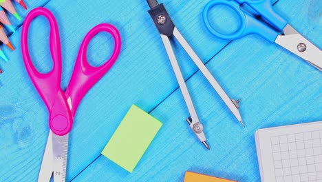 school supplies on a blue table background