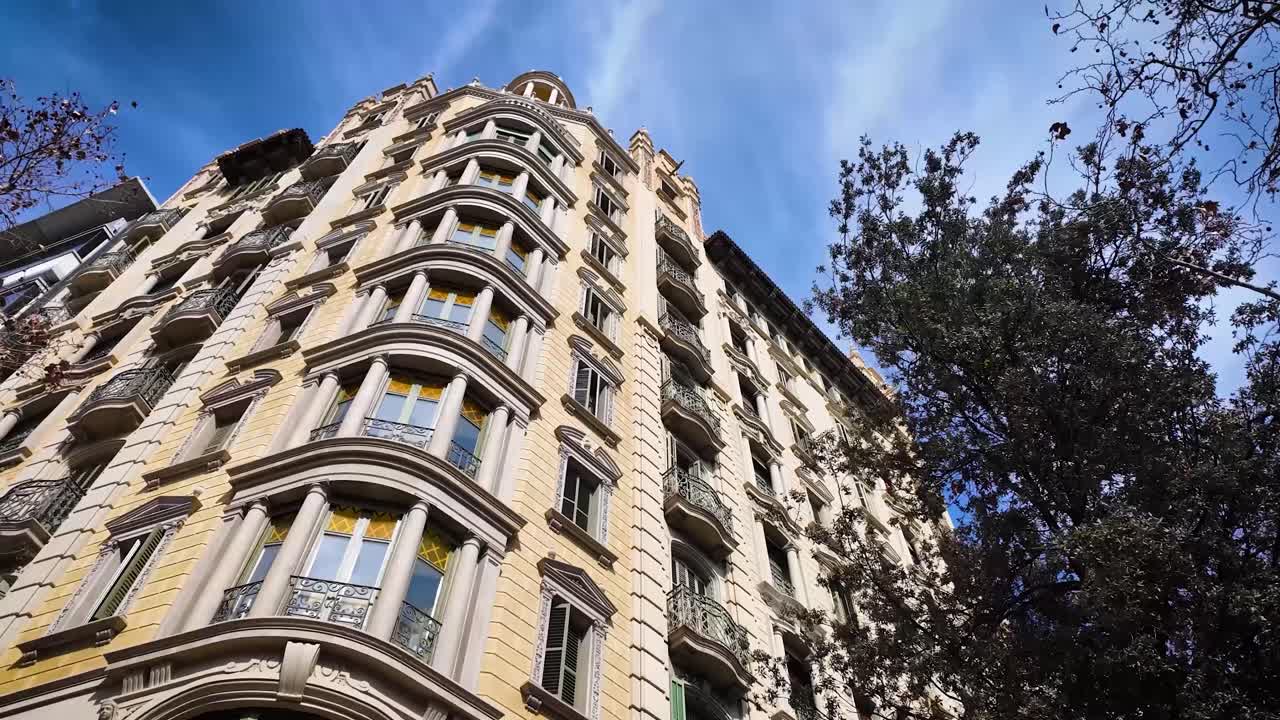 Midday close-up shot of a building located on the central Passeig de Gràcia in Barcelona, Spain