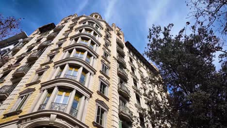 midday close-up shot of a building located on the central passeig de gràcia in barcelona, spain