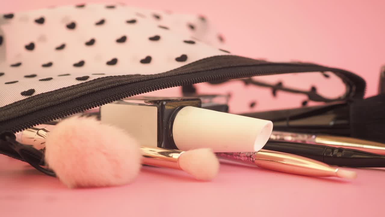 Makeup and cosmetics on a pink background