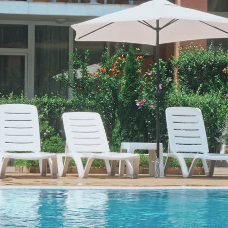 beautiful luxury umbrella and chair around outdoor swimming pool