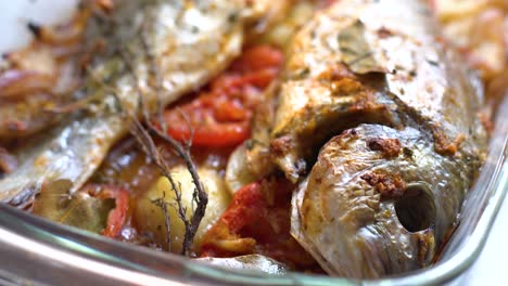 baked sea bream dish with potato and tomato