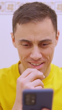 happy man using mobile phone in bathroom