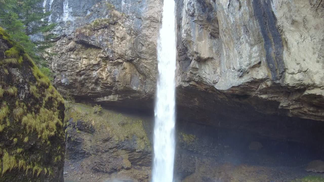 Tilt down the impressive Berglist&uuml;ber waterfall in Switzerland