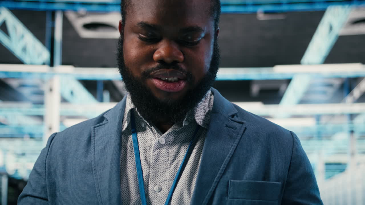 African American Man Using Tablet in Data Center