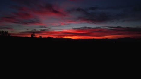 drone in night flight with position lights flashing. drone flying with colorful sky at sunset. andalusia. spain.