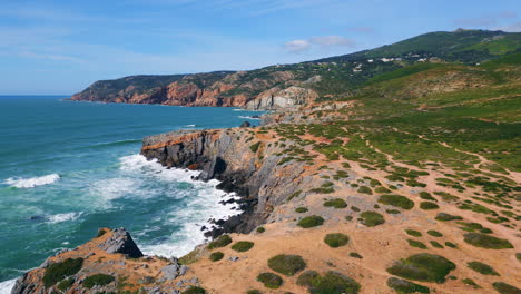 beautiful marine panorama sunny rocky shoreline washing by ocean water aerial.