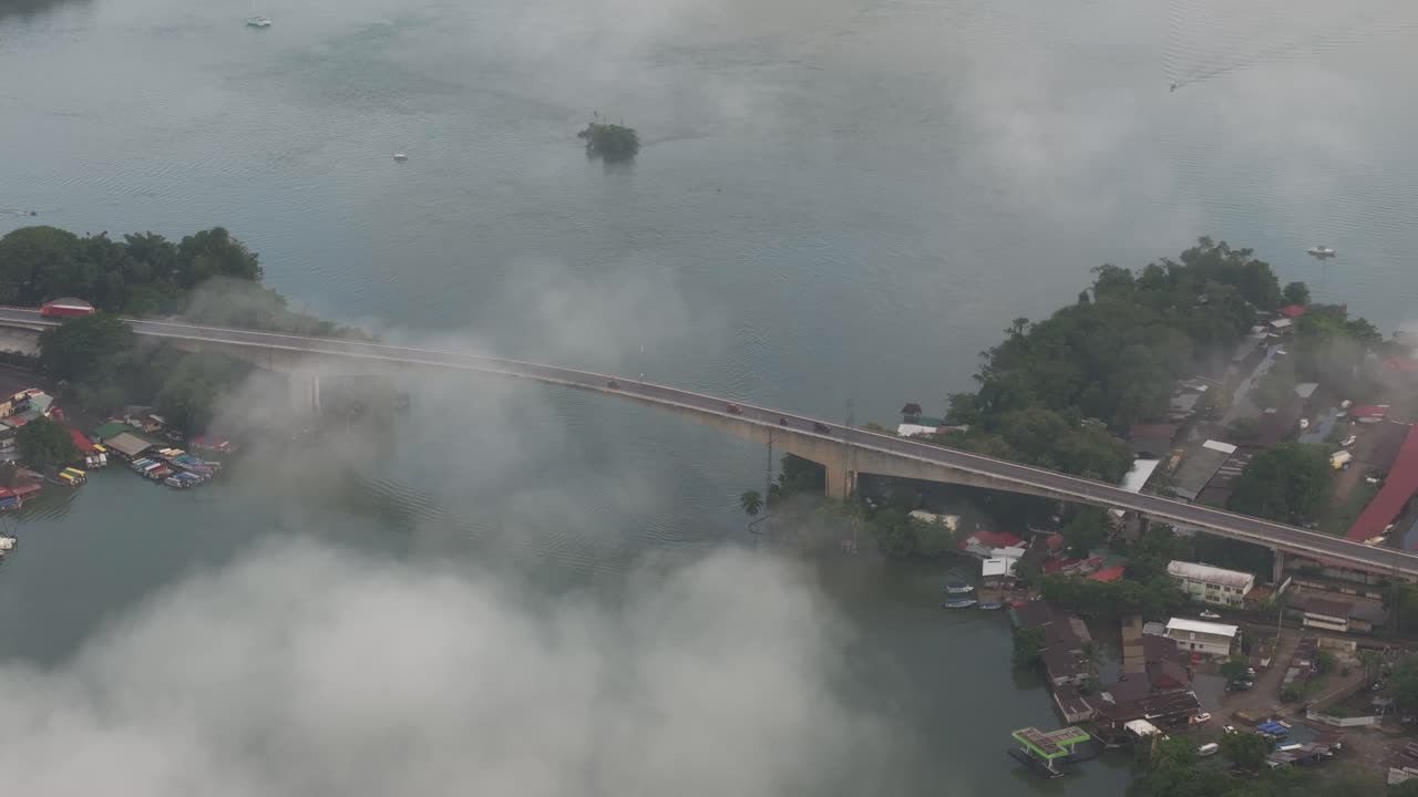 Puente de R&iacute;o Dulce bridge during low clouds in the morning, aerial