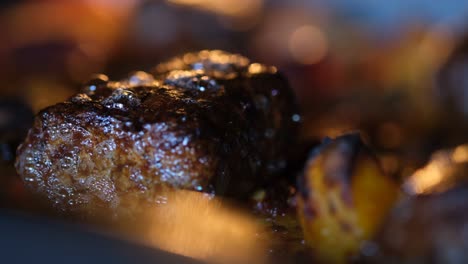 close up footage of cooking meatballs in the oven.