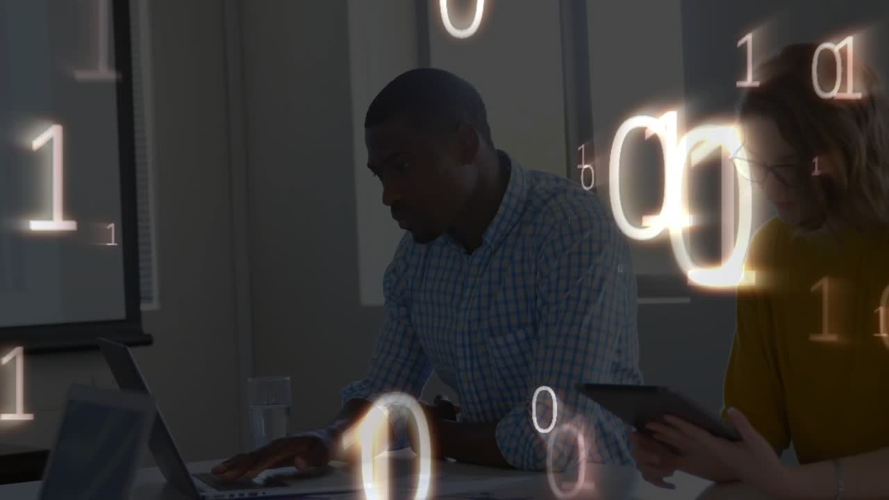 Coworkers typing laptop and scrolling tablet causing binary digits streaming around office