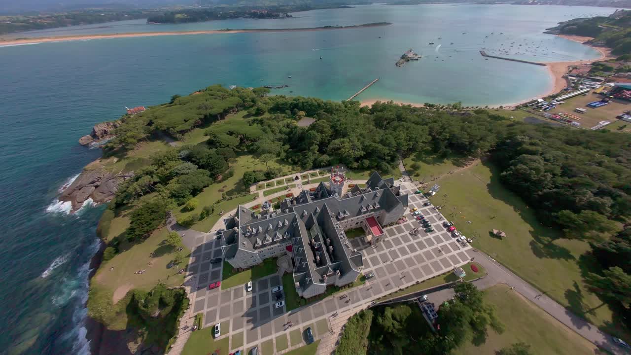 Dynamic and faster flyover combined with a small dive over the palace from the opposite direction, offering views of Santander Bay and distant Somo and Pedreña