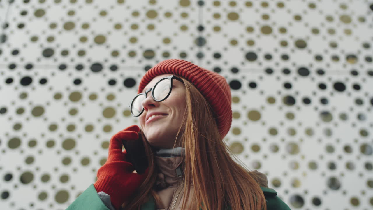 Woman Talking on Phone Outdoors in Winter