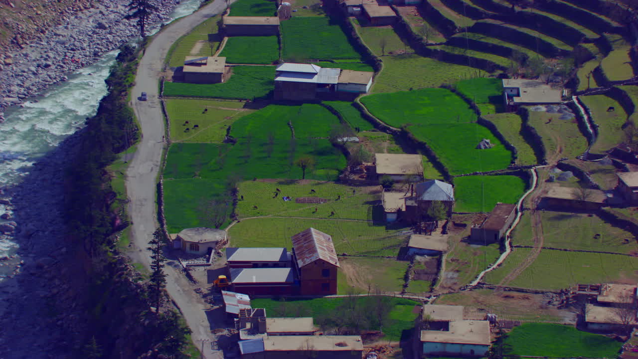 A picturesque village with beautiful watery scenes mountains and river, as well as charmingly crafted greenery