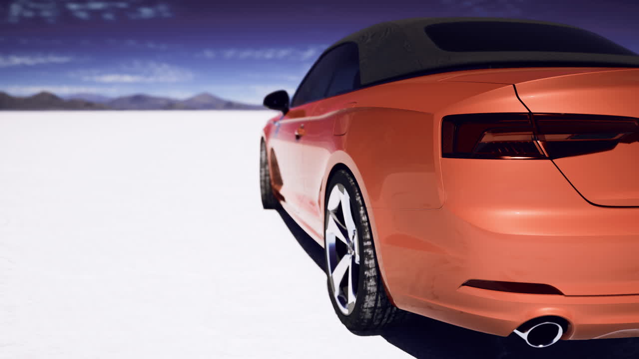 Orange sports car parked on the salt flats under a clear sky in daylight