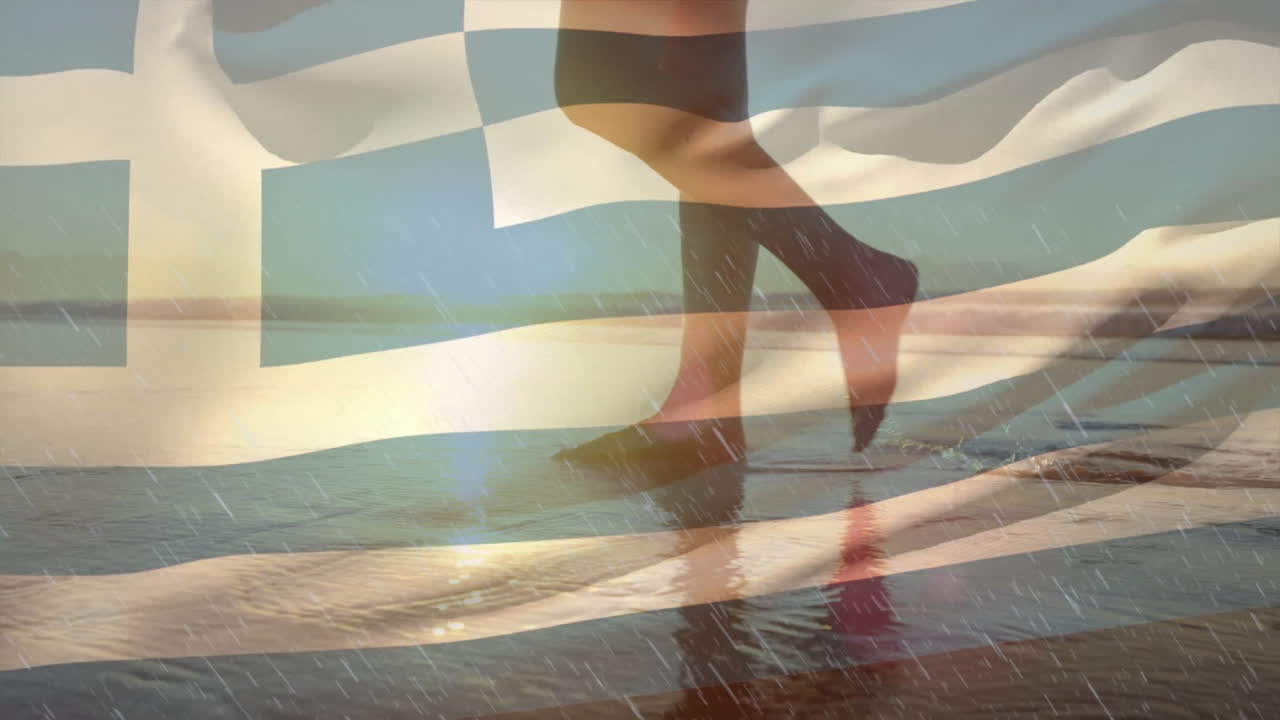Walking on beach with Greek flag animation overlay in sunlight