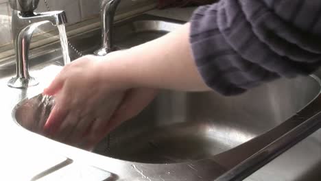 woman washing her hands