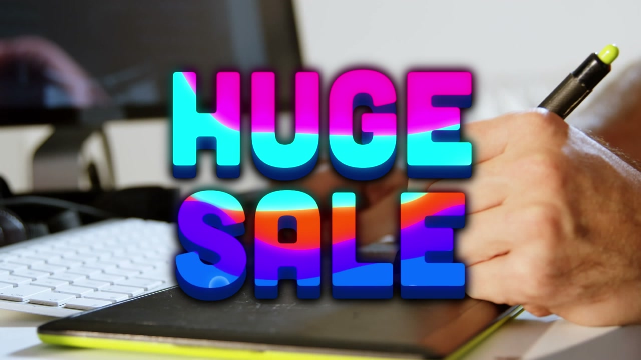 Animation of huge sale and colorful shapes over hands of caucasian man using graphic tablet