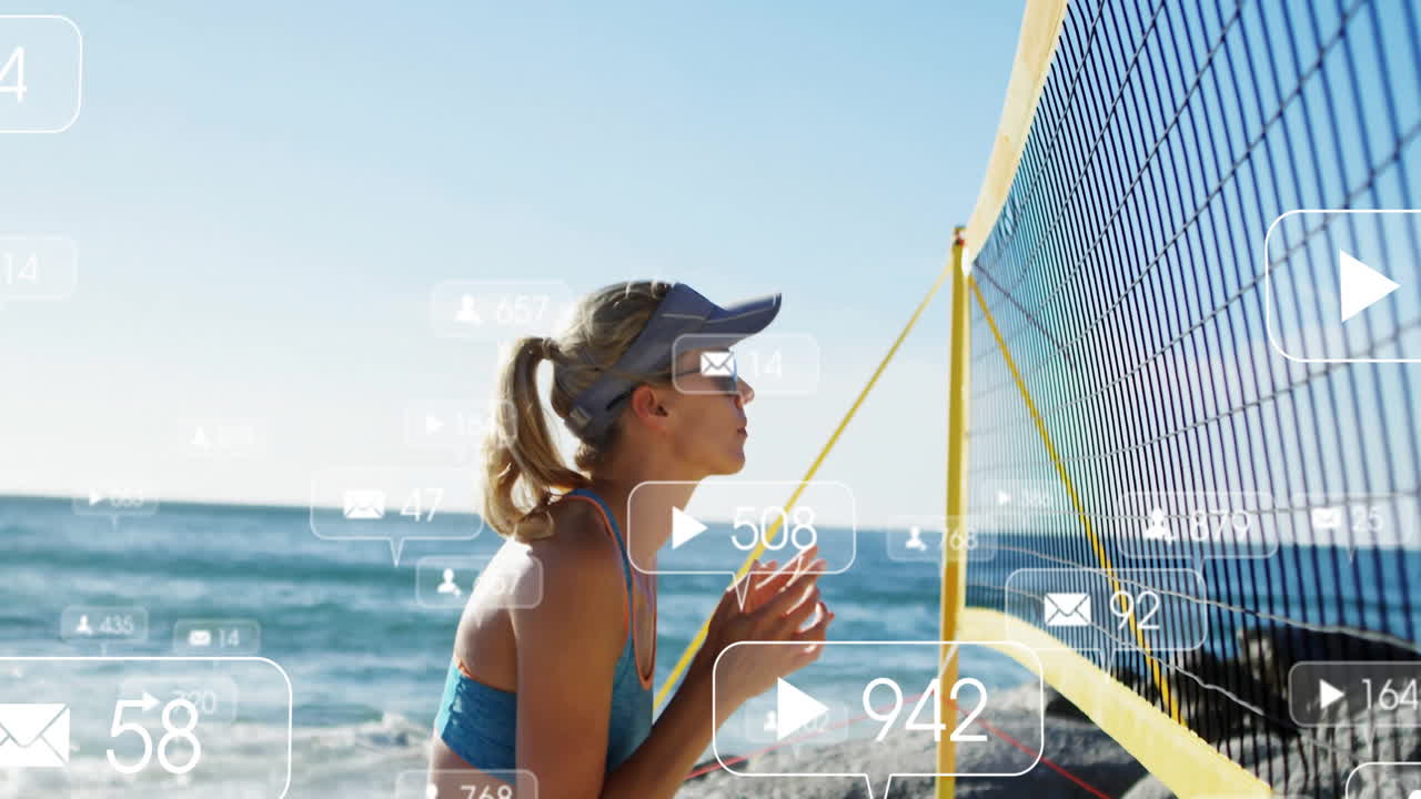 Playing beach volleyball, woman interacting with animation of social media icons
