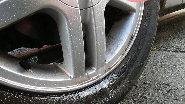 Spray cleaning metal alloy tyre trim vehicle detailing polishing clean