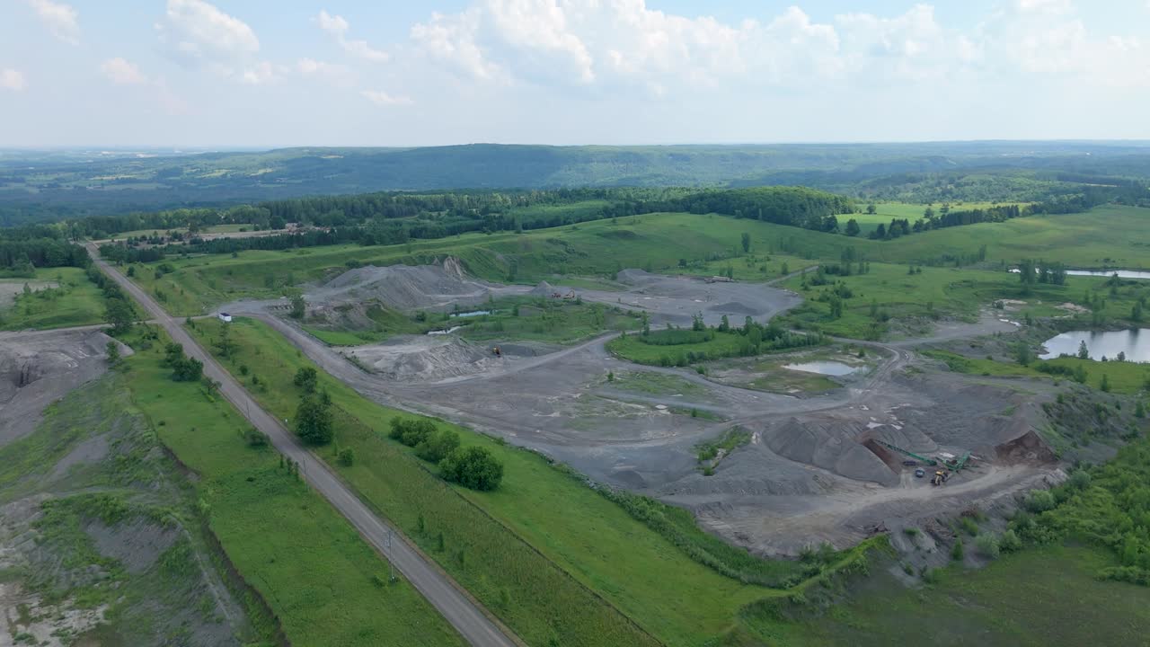 Aerial view of a gravel pit in Caledon, showing expansive greenery