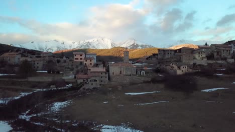 drone footage of a village on the snowy mountains