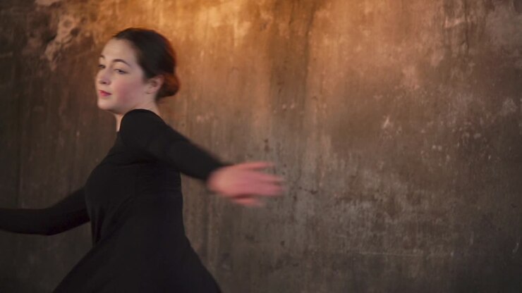 Woman Dancing in a Black Dress