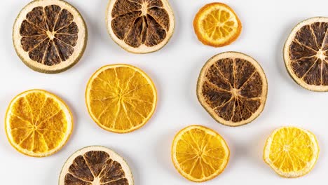 creative flat lay stop motion with moving and rotating sliced limes and lemons