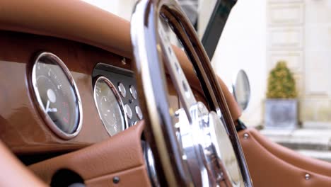 Close-Up-of-a-Morgan-Vintage-Car-Dashboard-with-Leather-Interior