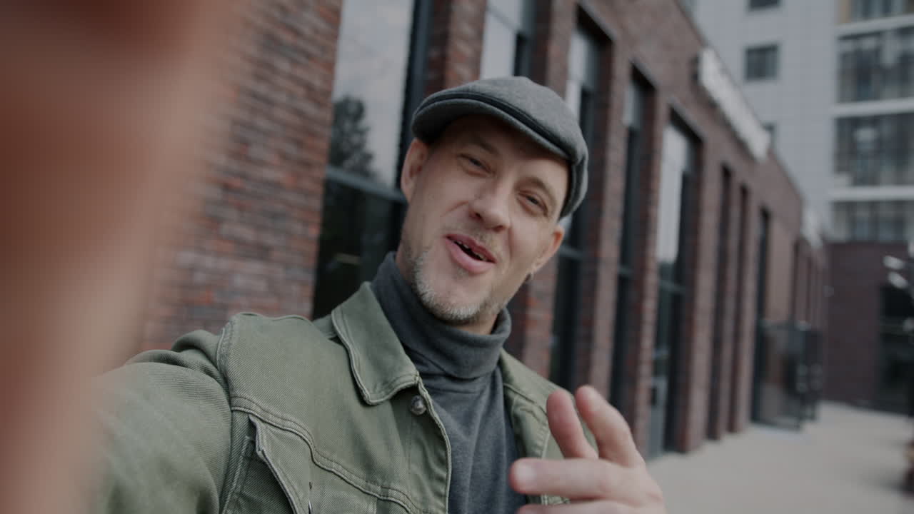 Man Taking a Selfie in a City