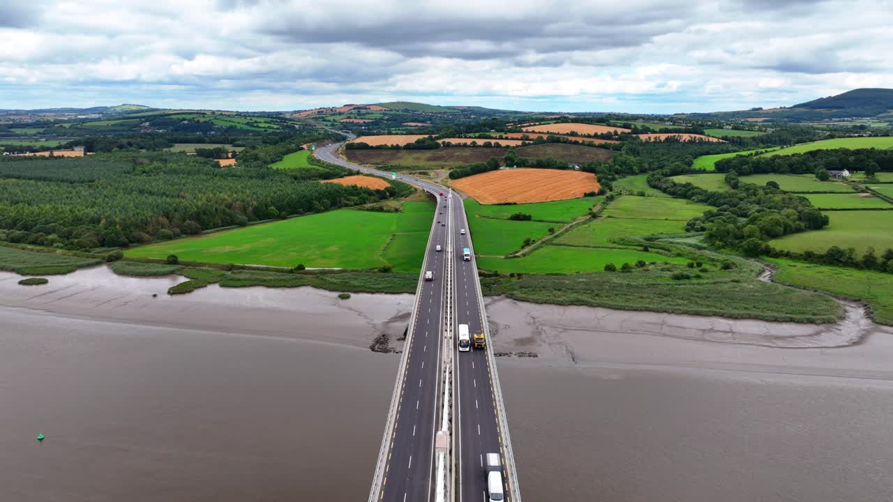 Ireland epic locations traffic on Rose Fitzgerald Kennedy bridge with lush fertile farmlands of Wexford