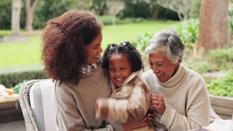 three generations of women laughing together