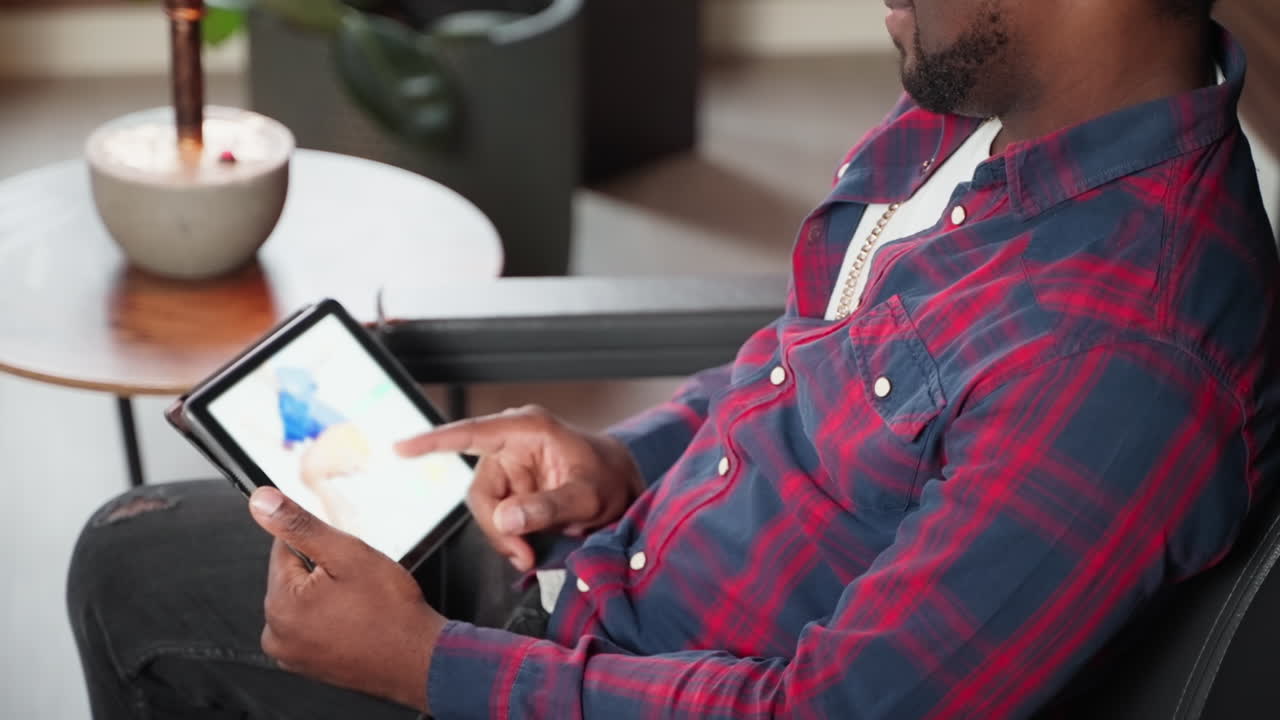Man Shopping Online Using a Tablet