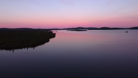 picturesque evening dusk blue hour aerial over calm lake in sweden