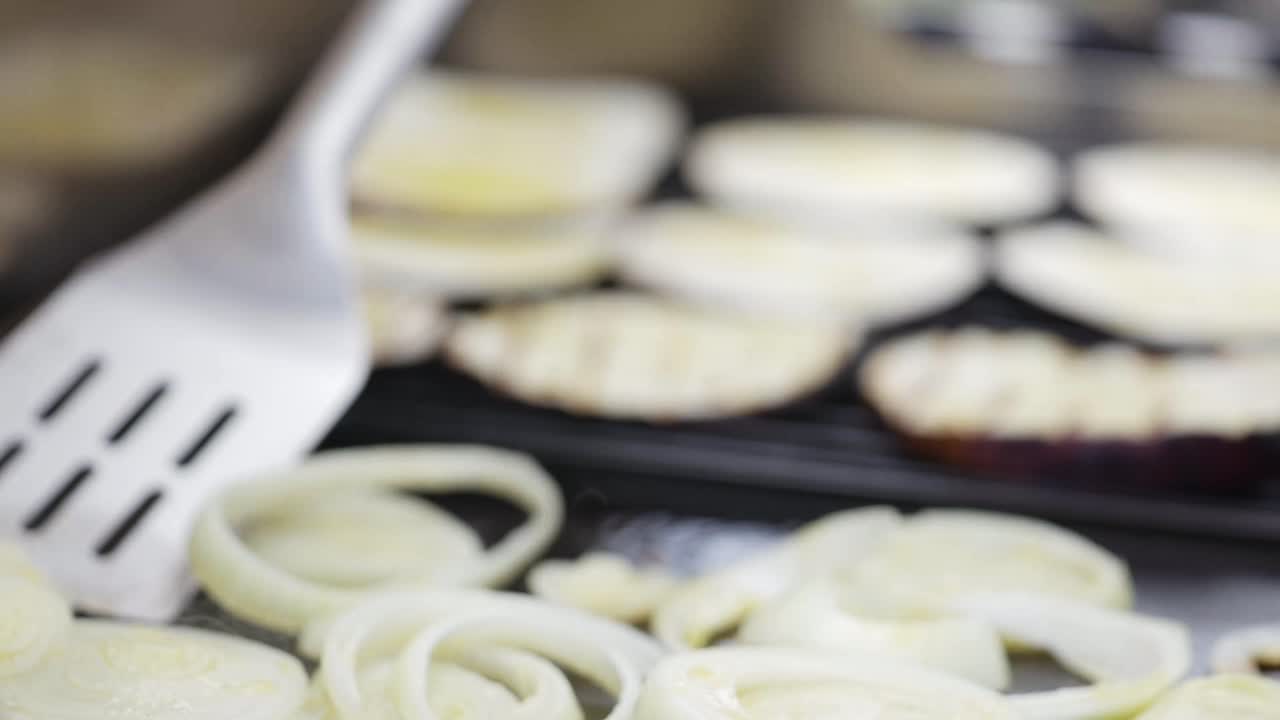 Flipping onions on outside kitchen