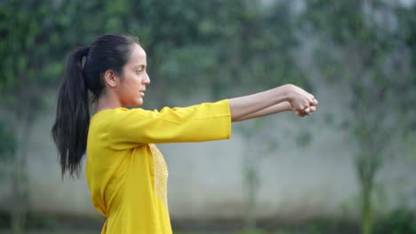 indian girl doing wrist exercise