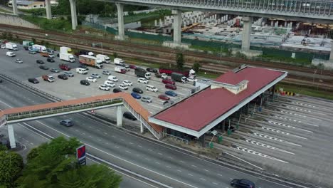 traffic jam appears near toll point in modern city, aerial view