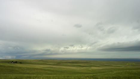 Distant Storm Clouds Moving Across Beautiful Open Green Hills And Country Side