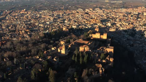 aerial view of granada, spain and alhambra palace and fortress on sunny summer evening