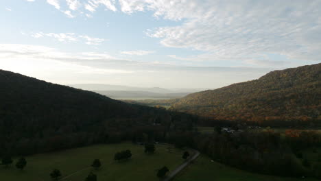 aerial footage of the sunrise with fog covered valleys in the distance in sequatchie cove tennessee in autumn