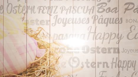 animation of happy easter text in different languages over easter eggs in basket on wood