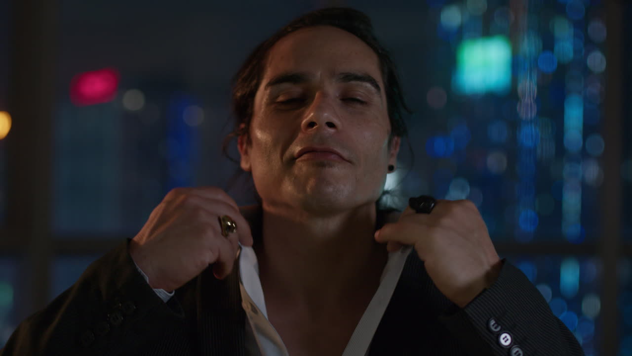 Man in a Suit at Night in a City