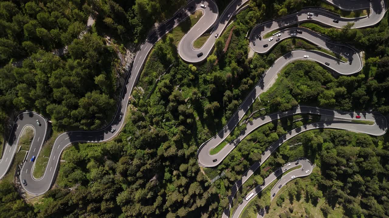 Switzerland Scenic alpine mountain road S reverse curve infrastructure aerial