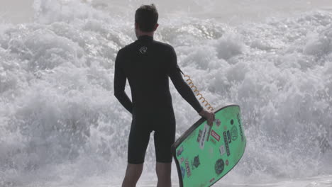 male surfer riding a wave