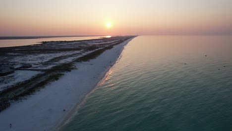 aerial view of sunrise on the gulf of mexico pensacola florida beach on a sunny morning pany out