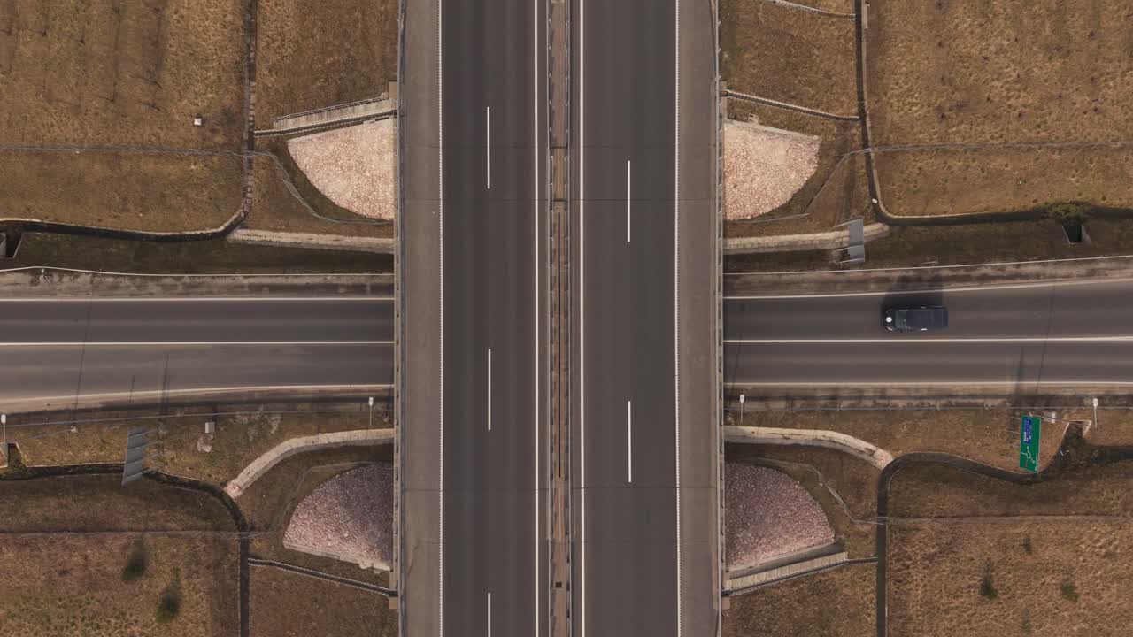Aerial highway overpass intersection with cars