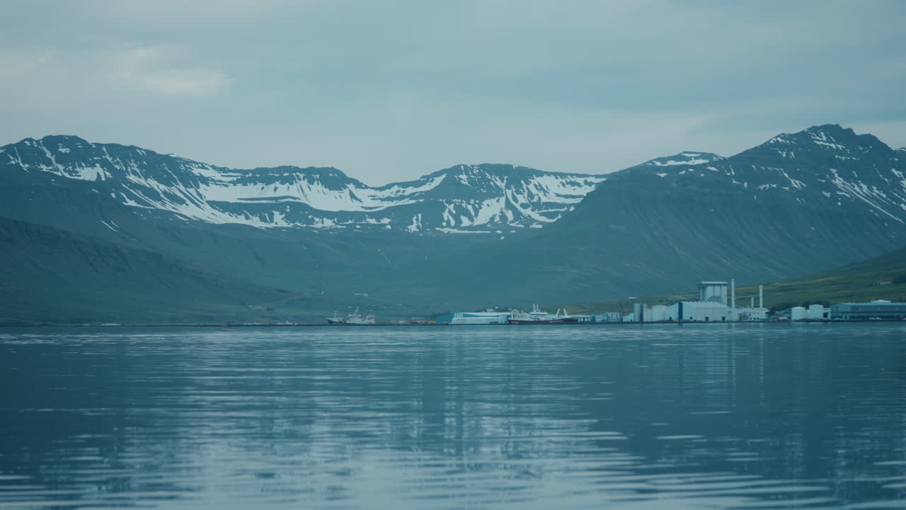 Static shot of Neskaupstaður landscape, east Iceland, water, ice, mountains, reflections